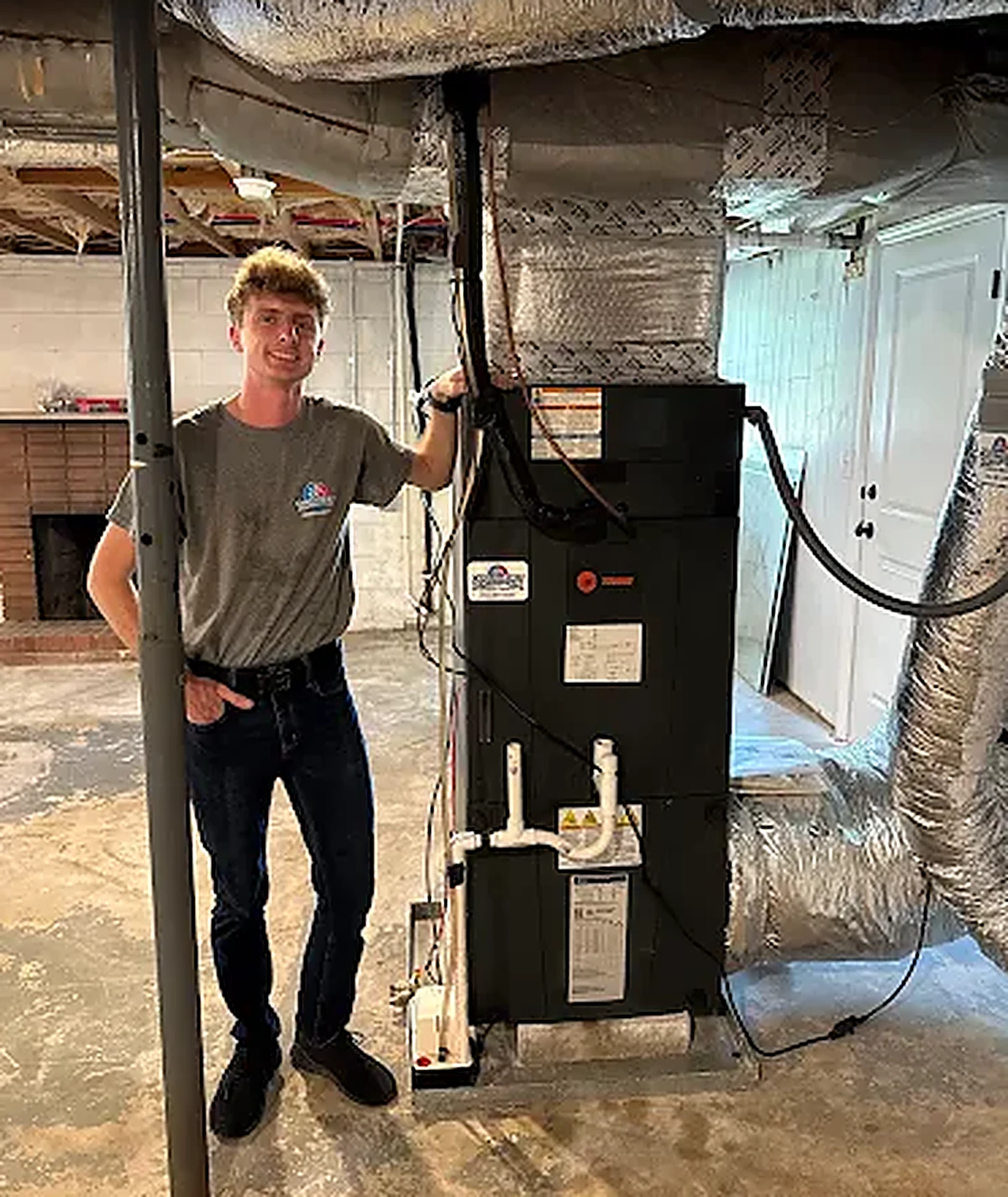Carolina First technician with a new basement air handler install