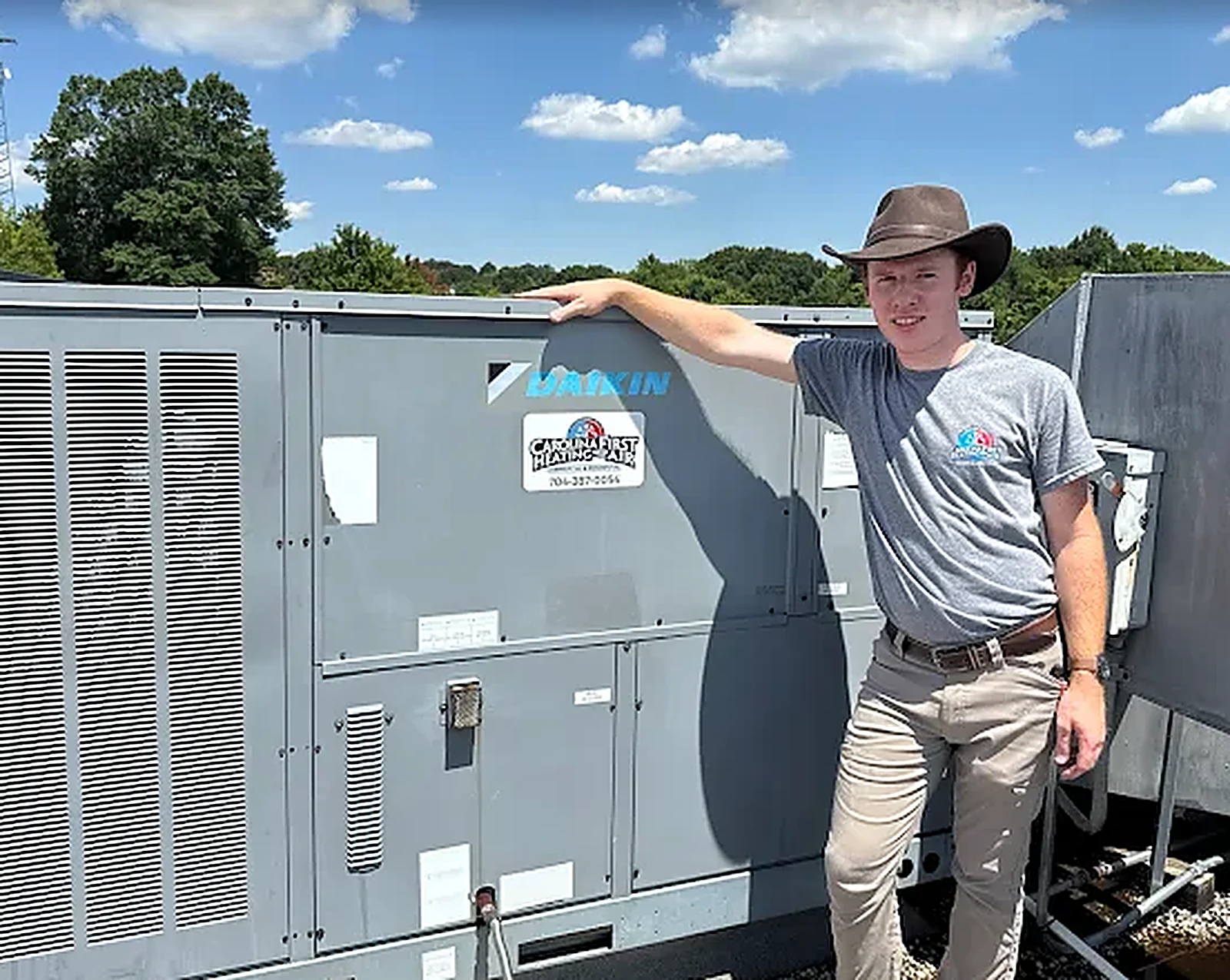 Carolina First technician with a Daikin commercial rooftop unit